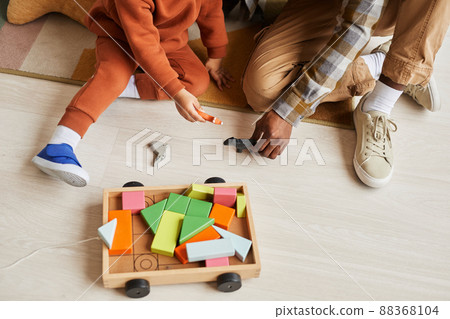 Father and Son Playing with Wooden Toys Father and Son Playing with Wooden Toys 88368104