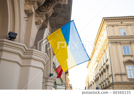 Ukrainian flag in city building. War in Ukraine 88368135