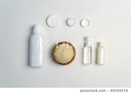 Rice skin care product and eco friendly accessories. Fermented beauty care trend. Flat lay Rice skin care product and eco friendly accessories. Fermented beauty care trend. Flat lay 88368419