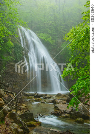 The Dzhur-Dzhur waterfall flows after heavy rain in the mountain range of the Crimean peninsula. The peninsula was annexed to the Russian Federation. Ukraine. 88368640