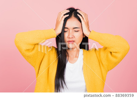 woman sad tired strain face holding hold head by hands 88369359