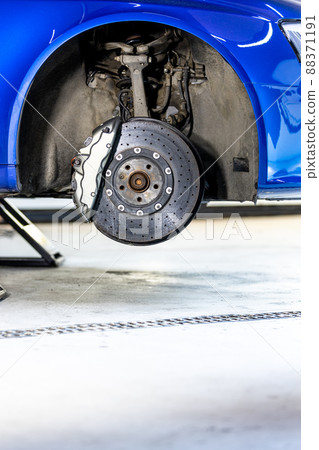 Close up of a modern car brakes during maintenance repair, transport concept 88371191