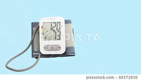 A device for measuring pressure, tonometer on a blue medical background. A device for measuring pressure, tonometer on a blue medical background. 88372650