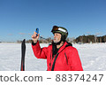 Man  measures wind speed with an anemometer 88374247