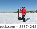 Man  measures wind speed with an anemometer 88374248
