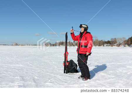 Man measures wind speed with an anemometer Man measures wind speed with an anemometer 88374248