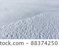 Relief snow surface of a frozen river in  winter 88374250