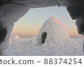 View from an igloo to another igloo  at sunset 88374254