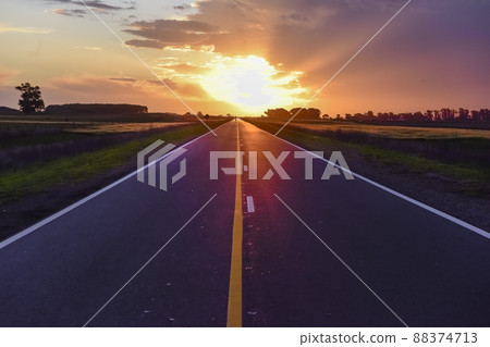 Landscape with road and stormy sky at sunset 88374713