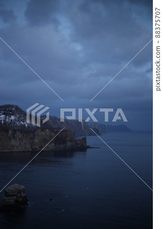 Rocks and dark sea that convey fear 88375707