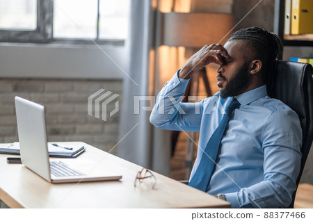 Exhausted company employee suffering from the eyestrain 88377466