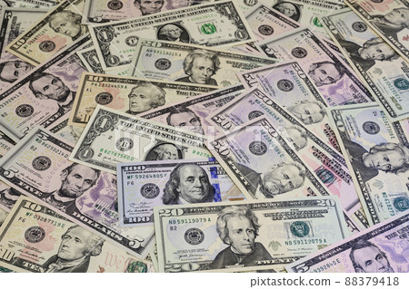 Banknotes of US dollars of different denominations arranged in random order 88379418