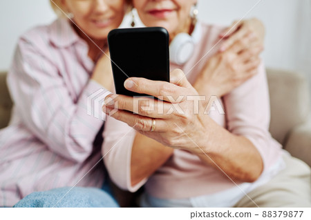 Senior Woman Holding Mobile Phone Close Up 88379877