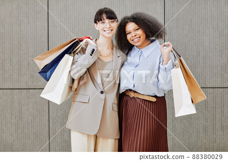 Two Young Women Enjoying Shopping 88380029