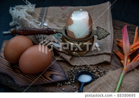 Boiled eggs with salt and pepper on beautiful wooden background, Nutrition concept. Boiled eggs with salt and pepper on beautiful wooden background, Nutrition concept. 88380695