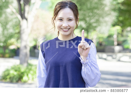 A woman with a pointing pose A woman with a pointing pose 88380877