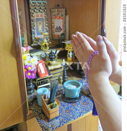 Gassho in front of the Buddhist altar 88381828