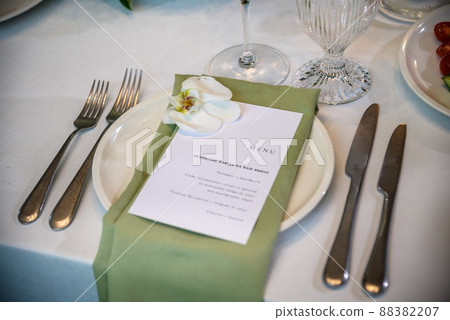 Wedding banquet. The festive table is served with plates with na 88382207