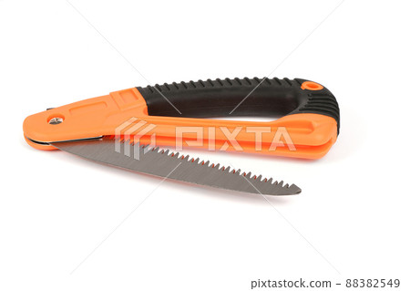 Folding garden saw in the folded state isolated on a white background, pocket saw. 88382549