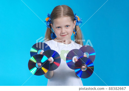 The girl holds CD 88382667