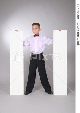 The boy holds two white board 88382744