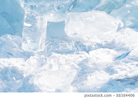 Ice hummocks on Baikal Lake. Transparent blue ice floe at sunset. Natural background. 88384406
