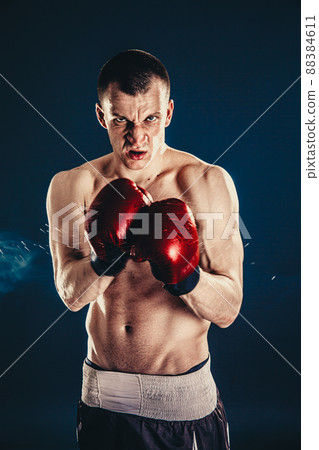 Sportsman boxer fighting on black background. Copy Space. Boxing sport concept 88384611