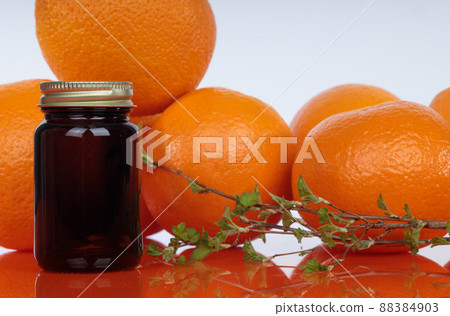Medicine bottles on orange background, natural healing properties of citrus. Concept, natural remedies 88384903