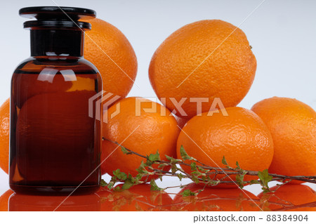Medicine bottle against a background of orange ovates. Medicine bottle against a background of orange ovates. 88384904