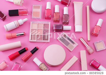 A set of makeup tools placed on a pink background 88385028