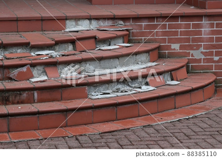 Broken concrete staircase. broken entrance stairs. 88385110