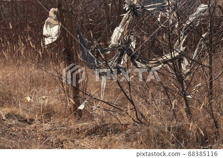 The problem related to plastic waste, foil. Abandoned plastic waste The problem related to plastic waste, foil. Abandoned plastic waste 88385116