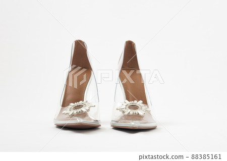 Transparent women's shoes with high heels. Shoes with crystals. Cinderella shoes. Front view Transparent women's shoes with high heels. Shoes with crystals. Cinderella shoes. Front view 88385161