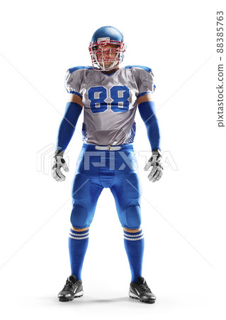 Brutal an American football player stands in white background. Isolated on white. Sports emotions 88385763