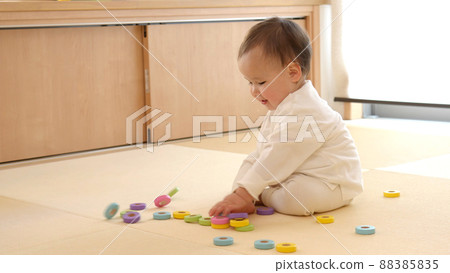 Baby playing with building blocks 88385835