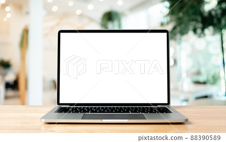 Laptop blank screen on wood table with blurred coffee shop cafe Laptop blank screen on wood table with blurred coffee shop cafe 88390589