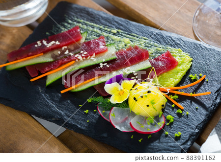Raw tuna sashimi with cucumber and avocado sauce Raw tuna sashimi with cucumber and avocado sauce 88391162