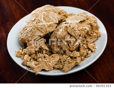 Traditional russian dessert halva from sunflower at plate Traditional russian dessert halva from sunflower at plate 88391163