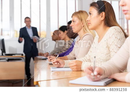 Young woman working during group business training 88391238