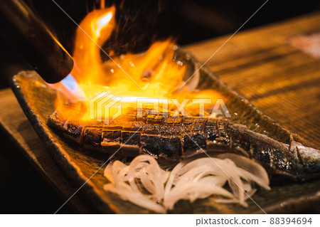 The moment when grilled mackerel is burned with a burner The moment when grilled mackerel is burned with a burner 88394694