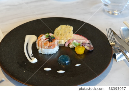 French cuisine on a black plate French cuisine on a black plate 88395057