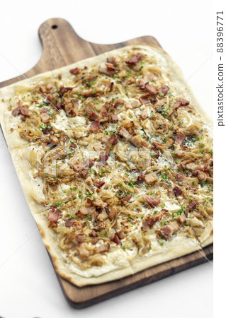 Flammkuchen tarte flambee flatbread traditional german alsace pizza Flammkuchen tarte flambee flatbread traditional german alsace pizza 88396771