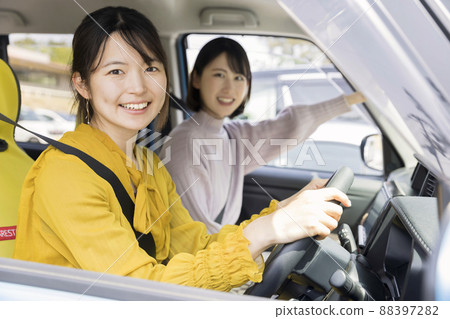 Two young women going out by car 88397282