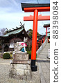 Torii and guardian dogs at a shrine famous for marriage 88398084