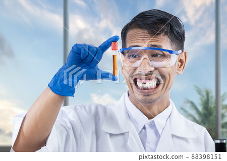 Asian nerd scientist holding a sample tube 88398151