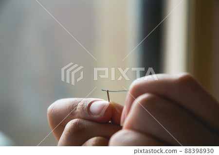 Scene to thread through needle 88398930