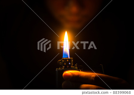 metal lighter in man's hand 88399068