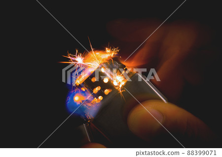 metal lighter in man's hand 88399071