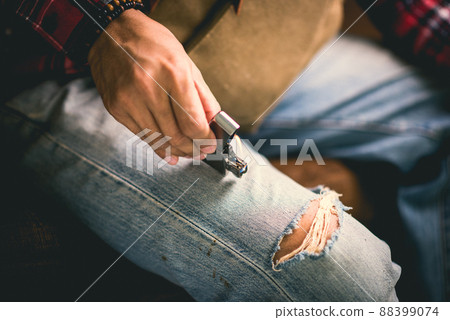 metal lighter in man's hand 88399074