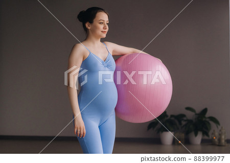 Pregnant woman during fitness classes with a fitball 88399977